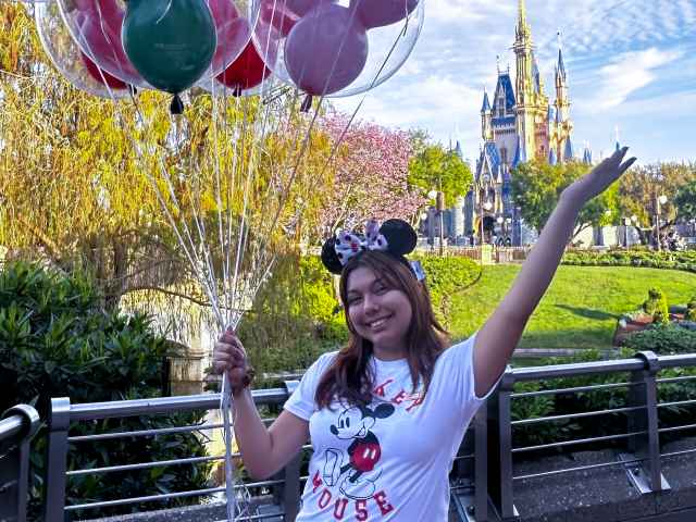 Diana La Torre holding Disney balloons
