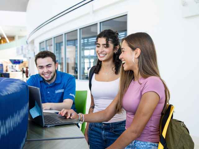Students around a laptop