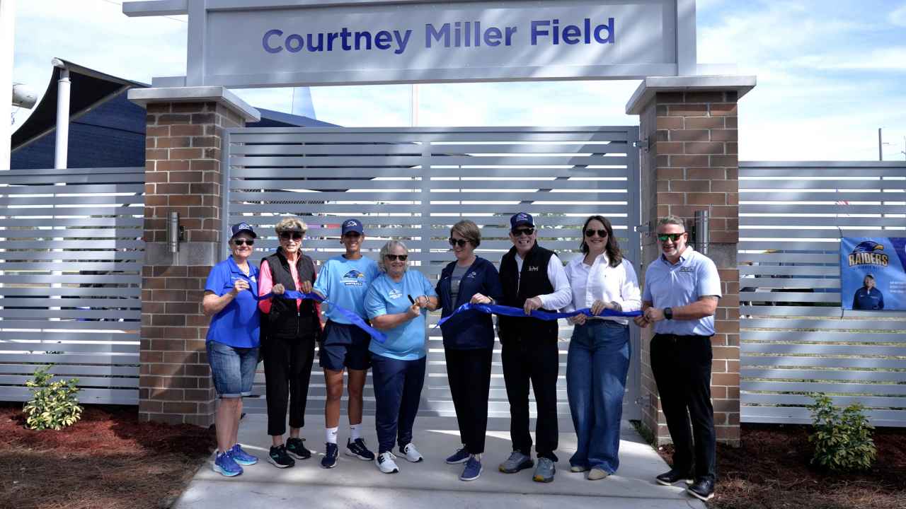 Legendary Raider Softball Head Coach Courtney Miller cuts the ribbon at the dedication of the softball field named in her honor on Saturday, Jan. 24.