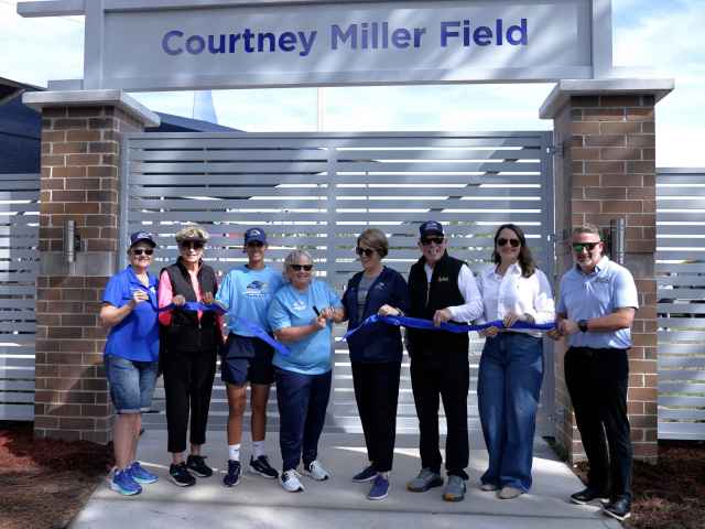 Legendary Raider Softball Head Coach Courtney Miller cuts the ribbon at the dedication of the softball field named in her honor on Saturday, Jan. 24.
