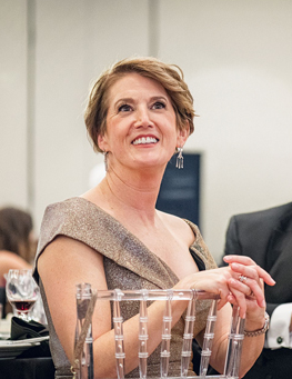 Dr. Georgia Lorenz smiling while attending a formal event.