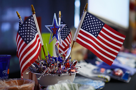 A table setting of USA flags and sparkly decorations