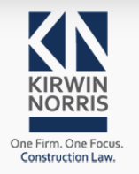 Kirwin Norris company logo that reads 'Kirwin Norris' in capital gray letters, underneath a dark blue rectangle says 'One Firm. One Focus.' in gray font and 'Construction Law' on the third line in blue font. Above the company name are three dark blue triangles that create a letter 'K' and two blue triangles that create a letter 'N'. 