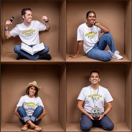 Phillip Martin, Renato Monsalve, Diamond Mcmillan, and Eve Hudson sitting in sections of a large cardboard box