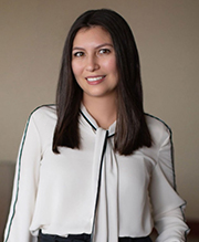 Picture of Alicia with long brown hair and white shirt