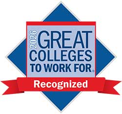 This graphic shows the Great Colleges to Work For 2026 recognition emblem, featuring bold blue text on a red and blue diamond-shaped background with a red ribbon banner.