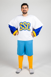 A person standing in the Rally suit and showing the white mascot jersey that reads 'SSC' on the front of shirt.