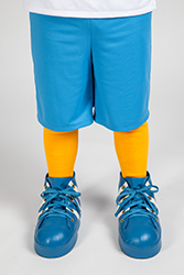A person standing in the Rally suit wearing the sneakers