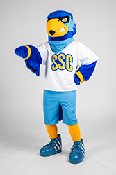 Rally standing with his right hand outward in a closed fist showing a 'Fist Bump'gesture