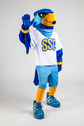 Rally standing with his right hand upward and outward, palm open, inviting a high five gesture